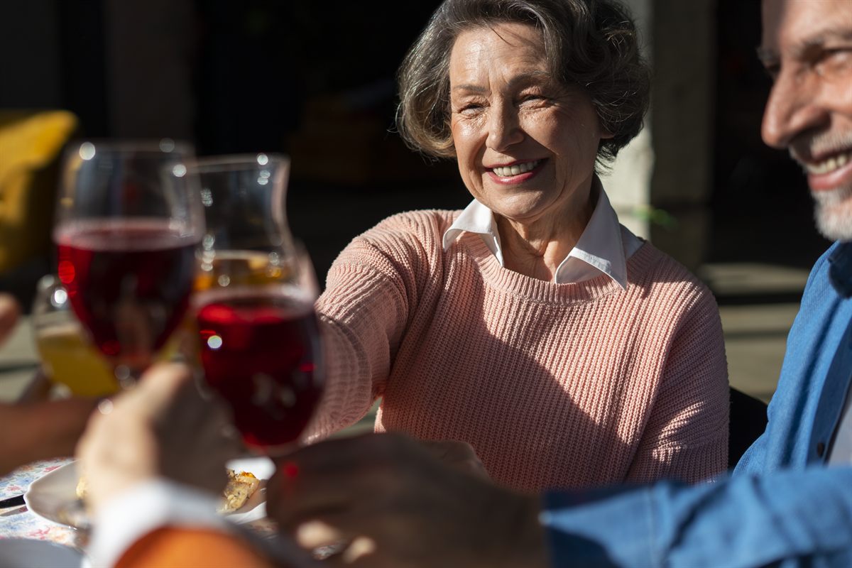 Senior friends enjoying wine together for the Aged Like Fine Wine Kelowna wine tour seniors discount